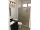 This bathroom offers dark granite counters, new fixtures and a glass enclosed shower at 1396 Couperin Dr, Henderson, NV 89052