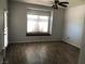 Cozy bedroom with ceiling fan, wood-look tile floors, and a window seat at 1396 Couperin Dr, Henderson, NV 89052