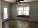 Bedroom featuring wood-look tile floors, ceiling fan, and built-in window seating at 1396 Couperin Dr, Henderson, NV 89052