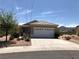 Charming single-story home featuring a two-car garage and desert landscaping at 1396 Couperin Dr, Henderson, NV 89052