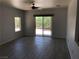 Spacious living room with tile floors, ceiling fan, and sliding door to backyard at 1396 Couperin Dr, Henderson, NV 89052
