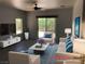 Bright living room with ceiling fan, neutral tones and sliding door access to the outside at 1396 Couperin Dr, Henderson, NV 89052