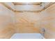 Close up of stylish bathroom tiled shower with accent tile and shower head at 1470 Elizabeth Ave # 1, Las Vegas, NV 89119