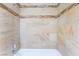 Close up of stylish bathroom tiled shower with accent tile and shower head at 1470 Elizabeth Ave # 1, Las Vegas, NV 89119