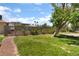 Community pool area with mature trees and greenery, offering a refreshing escape at 1470 Elizabeth Ave # 1, Las Vegas, NV 89119