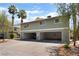 Multi-Gathering home featuring covered parking, mature landscaping, and neutral exterior paint at 1470 Elizabeth Ave # 1, Las Vegas, NV 89119