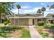 Attractive exterior showcasing a well-manicured lawn, walkway to the front door and desert landscaping at 1470 Elizabeth Ave # 1, Las Vegas, NV 89119