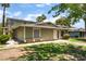 Charming one-story home with well-maintained front yard and walkway surrounded by lush greenery at 1470 Elizabeth Ave # 1, Las Vegas, NV 89119