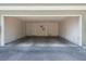 Attached two car garage that has concrete flooring and white walls at 1470 Elizabeth Ave # 1, Las Vegas, NV 89119