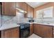 This kitchen features stainless steel appliances, sleek countertops, and a stylish backsplash at 1470 Elizabeth Ave # 1, Las Vegas, NV 89119