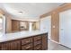 Bright living room featuring an eat-in kitchen island with natural light and tile floors at 1470 Elizabeth Ave # 1, Las Vegas, NV 89119