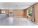 Bright living room with tile flooring and large windows with curtains, providing ample natural light at 1470 Elizabeth Ave # 1, Las Vegas, NV 89119