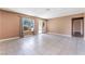 Large living area with tile floors, neutral color palette, and views of the front yard at 1470 Elizabeth Ave # 1, Las Vegas, NV 89119