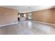 Spacious living room featuring tile floors, neutral paint, and a view to the kitchen at 1470 Elizabeth Ave # 1, Las Vegas, NV 89119