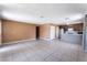 Open concept living area with tile floors, neutral paint, and a kitchen with stainless steel appliances at 1470 Elizabeth Ave # 1, Las Vegas, NV 89119