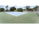 Well-maintained tennis court surrounded by green space, ready for a friendly match at 1470 Elizabeth Ave # 1, Las Vegas, NV 89119