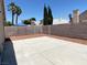 This backyard features a concrete patio and ample space for outdoor entertaining and relaxation at 1501 Wintergreen Dr, Las Vegas, NV 89128