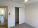 Bedroom featuring closet with sliding doors, carpet flooring, and bright window at 1501 Wintergreen Dr, Las Vegas, NV 89128