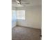 Cozy bedroom with neutral carpet, horizontal blinds, and natural light at 1501 Wintergreen Dr, Las Vegas, NV 89128