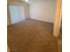 A bright bedroom with neutral carpet and a high, sloped ceiling at 1501 Wintergreen Dr, Las Vegas, NV 89128
