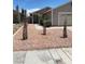 Charming single story home showcasing desert landscaping and a two car garage at 1501 Wintergreen Dr, Las Vegas, NV 89128