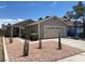 Charming single story home showcasing desert landscaping and a two car garage at 1501 Wintergreen Dr, Las Vegas, NV 89128