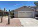 Charming single story home showcasing desert landscaping and a two car garage at 1501 Wintergreen Dr, Las Vegas, NV 89128