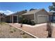 Charming single story home showcasing desert landscaping and a two car garage at 1501 Wintergreen Dr, Las Vegas, NV 89128