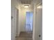 Hallway view with neutral carpet, multiple doors, and recessed ceiling light at 1501 Wintergreen Dr, Las Vegas, NV 89128