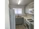 Bright kitchen features stainless steel appliances, light gray cabinetry, and stylish tile flooring at 1501 Wintergreen Dr, Las Vegas, NV 89128