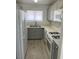 Bright kitchen features stainless steel appliances, light gray cabinetry, and stylish tile flooring at 1501 Wintergreen Dr, Las Vegas, NV 89128