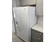 Bright kitchen features stainless steel appliances, light gray cabinetry, and modern refrigerator at 1501 Wintergreen Dr, Las Vegas, NV 89128