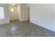 The bright living room features wood-look tile flooring and crisp white walls at 1501 Wintergreen Dr, Las Vegas, NV 89128