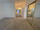 Spacious bedroom featuring neutral carpet and an en suite bath at 1501 Wintergreen Dr, Las Vegas, NV 89128