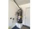 This well-maintained water heater is housed inside the garage with easy access for maintenance at 1501 Wintergreen Dr, Las Vegas, NV 89128