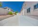 Spacious backyard with lush plants, great for outdoor gatherings and recreational activities at 1551 Echo Falls Ave, Las Vegas, NV 89183