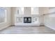 Close up of a modern fireplace with white tile in a brightly lit living room at 1551 Echo Falls Ave, Las Vegas, NV 89183