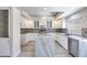Modern kitchen with white cabinets, granite countertops, and stainless steel appliances at 1551 Echo Falls Ave, Las Vegas, NV 89183