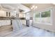Updated kitchen with stainless steel appliances, granite countertops, and an island at 1551 Echo Falls Ave, Las Vegas, NV 89183