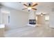 Neutral living room with a unique modern fireplace, a ceiling fan, and plank flooring at 1551 Echo Falls Ave, Las Vegas, NV 89183