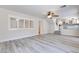 Open living room with hardwood floors, a ceiling fan, and lots of natural light at 1551 Echo Falls Ave, Las Vegas, NV 89183