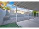Spacious backyard featuring a covered patio area with a block wall surround at 1728 S Christy Ln, Las Vegas, NV 89142