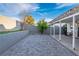 Backyard showcasing patio space, a block wall, and low-maintenance landscaping at 1728 S Christy Ln, Las Vegas, NV 89142