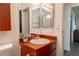 Bathroom featuring a wood vanity, ample mirror space, and easy access to the shower at 1728 S Christy Ln, Las Vegas, NV 89142