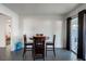 Dining area with tile floors, access to the backyard, and seating for four at 1728 S Christy Ln, Las Vegas, NV 89142