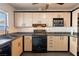 Kitchen featuring stainless steel appliances and ample cabinet space at 1728 S Christy Ln, Las Vegas, NV 89142