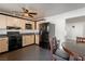 Open-concept kitchen boasting stainless steel appliances and a ceiling fan at 1728 S Christy Ln, Las Vegas, NV 89142