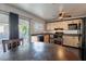 Eat-in kitchen with stainless steel appliances and sliding glass door at 1728 S Christy Ln, Las Vegas, NV 89142