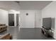 Open concept living room with two doors and tile floors at 1728 S Christy Ln, Las Vegas, NV 89142