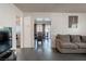 Spacious living room with comfortable seating and views into the dining area at 1728 S Christy Ln, Las Vegas, NV 89142